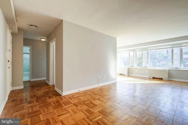 a view of an empty room with a window