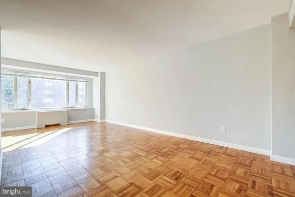 a view of an empty room with a window