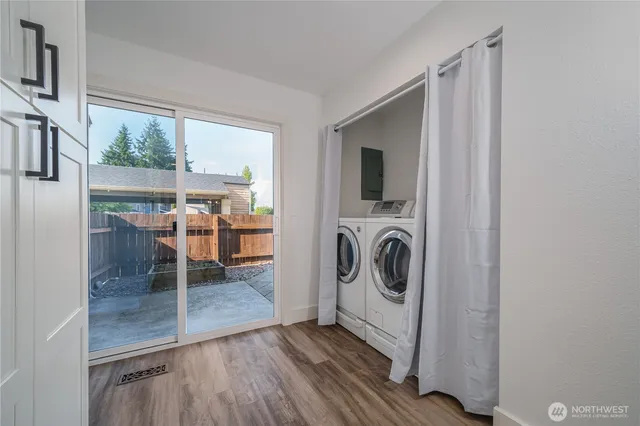 a view of a hallway with washer and dryer