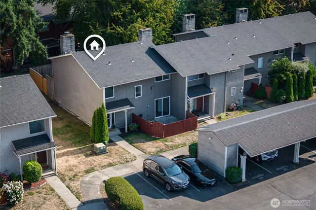 a aerial view of a house with a yard