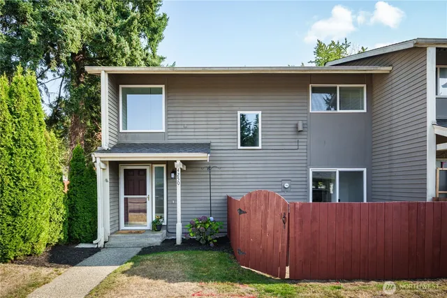 a view of house with a yard