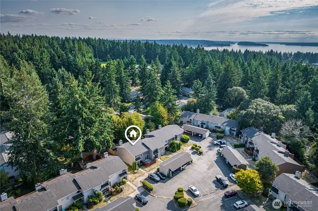an aerial view of multiple house with yard