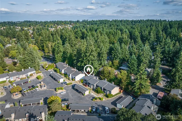 an aerial view of house with yard swimming pool and outdoor seating