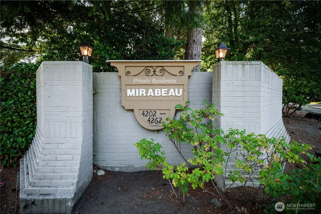 a sign that is on a brick wall