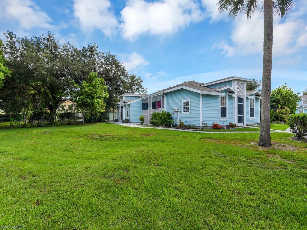 2160 43rd Terrace Southwest, Unit 49 Naples, FL 34116 - Photo 18 of 22 Spacious Side Yard