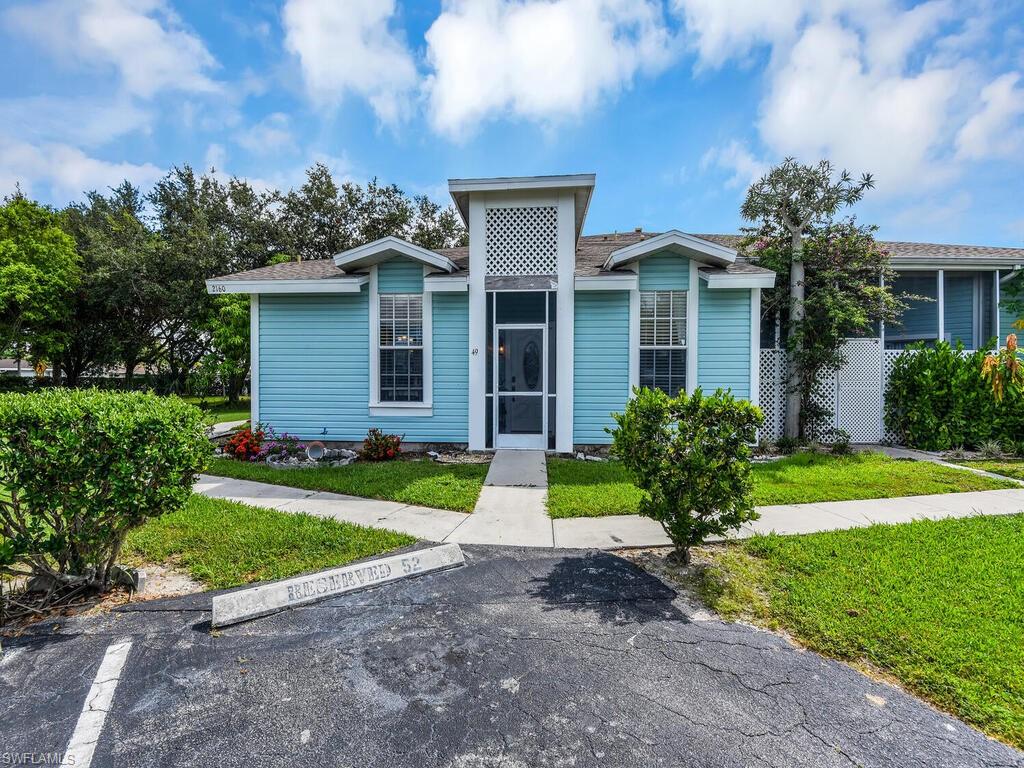 2160 43rd Terrace Southwest, Unit 49 Naples, FL 34116 - Photo 3 of 22 Screened Front Entry