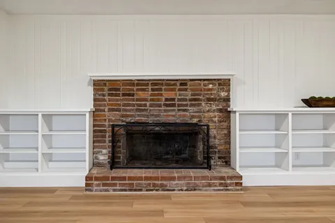 a spacious bedroom with a bed and a table