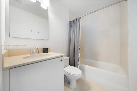 a bathroom with a sink a toilet and a bathtub