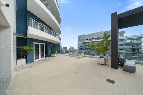 a view of a house with couches in front of building