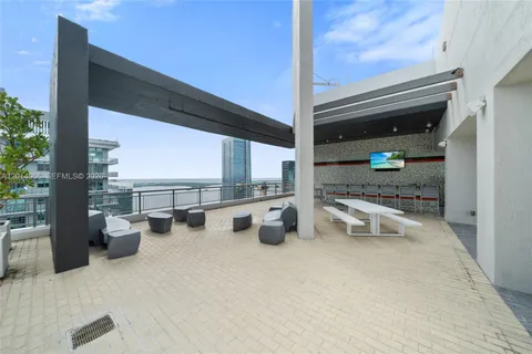 a view of a terrace with chairs and potted plants