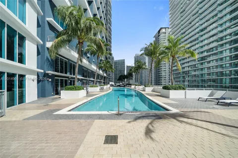 a view of a swimming pool with a lounge chairs