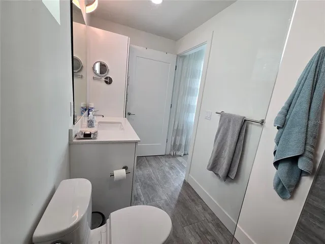 a bathroom with a toilet sink and tub
