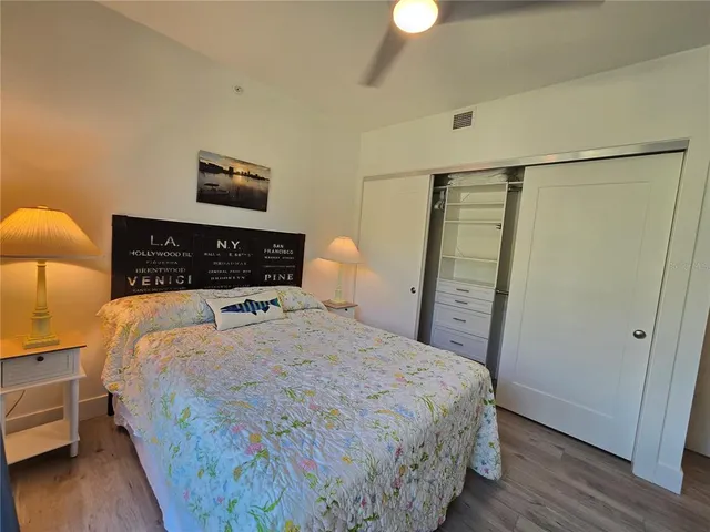 a bedroom with a bed and a lamp