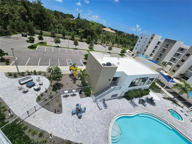 an aerial view of a house with a swimming pool