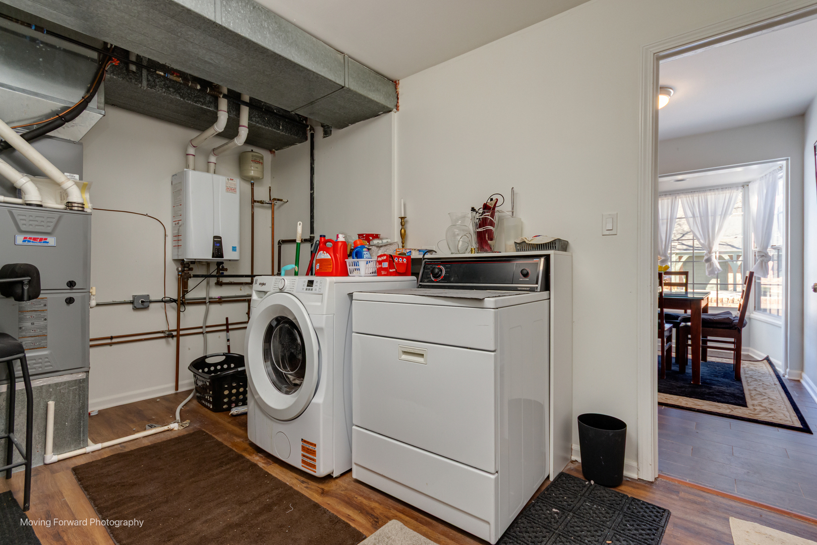 133 Rivershire Lane Lincolnshire, IL 60069 - Photo 12 of 26 a view of a storage & utility room with washer and dryer