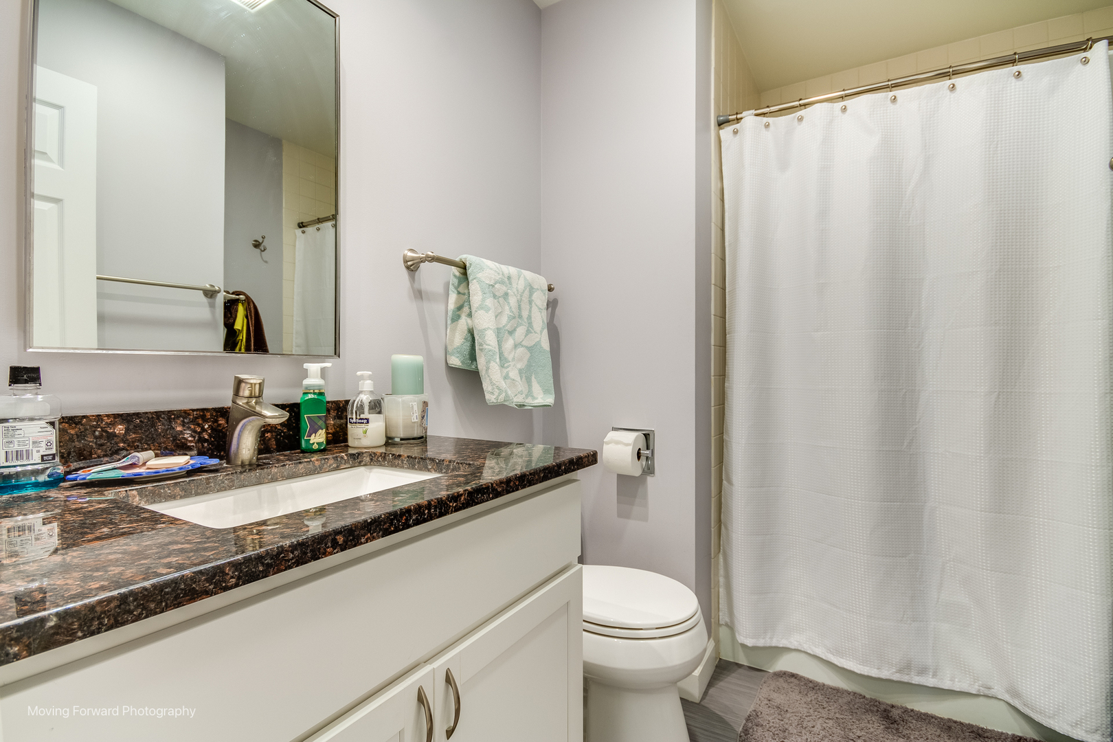 133 Rivershire Lane Lincolnshire, IL 60069 - Photo 20 of 26 a bathroom with a granite countertop sink and a mirror