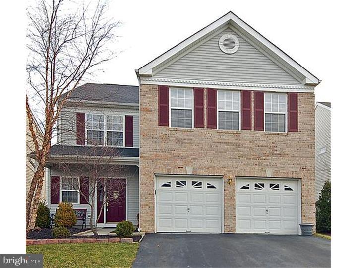 3 Sandstone Road East Windsor, NJ 08520 - Photo 2 of 24 a front view of a house with a yard