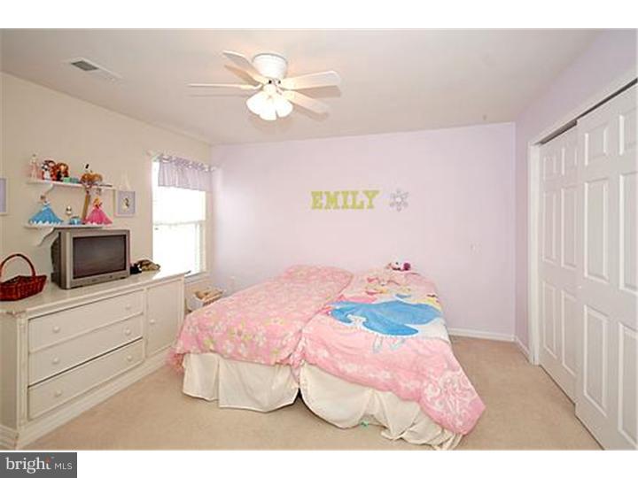 3 Sandstone Road East Windsor, NJ 08520 - Photo 20 of 24 a bedroom with a bed and a chandelier