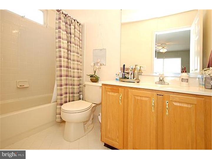 3 Sandstone Road East Windsor, NJ 08520 - Photo 21 of 24 a bathroom with a sink a toilet and shower