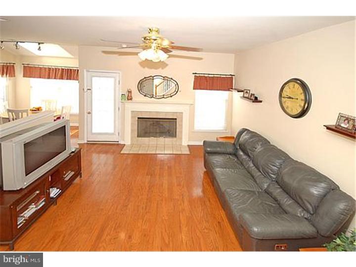 3 Sandstone Road East Windsor, NJ 08520 - Photo 4 of 24 a living room with furniture and a fireplace