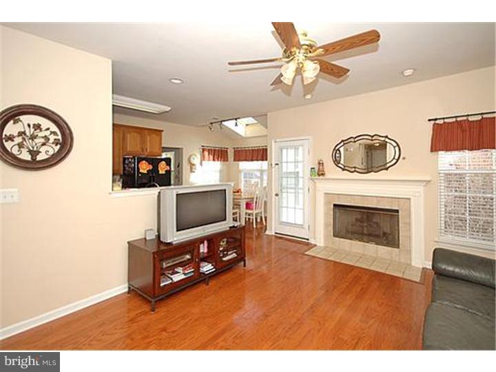 3 Sandstone Road East Windsor, NJ 08520 - Photo 5 of 24 a living room with furniture and a fireplace