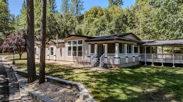 a front view of a house with yard