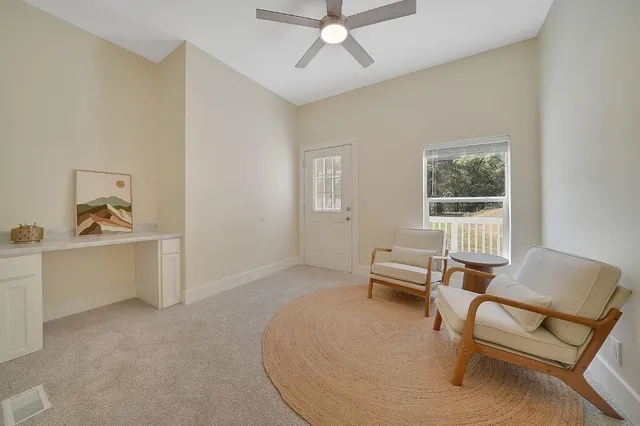 a living room with furniture and a window