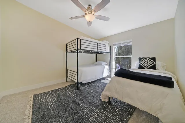 a bedroom with a bed and window