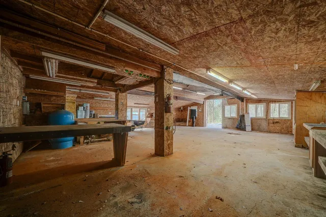 a view of a porch with furniture and front door
