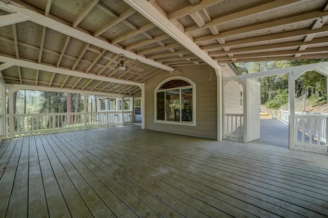 a view of porch with wooden floor