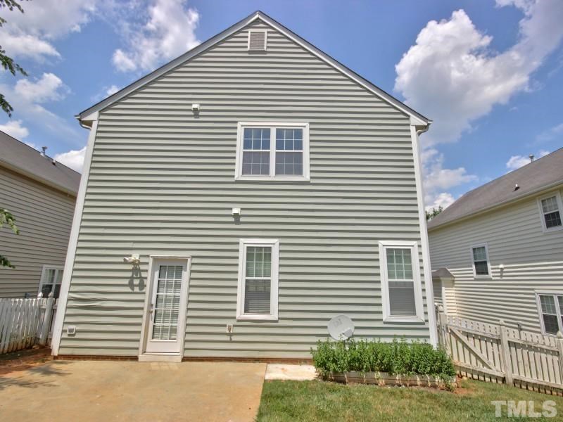 5009 Morning Edge Drive Raleigh, NC 27613 - Photo 22 of 25 a view of a house with a yard and plants