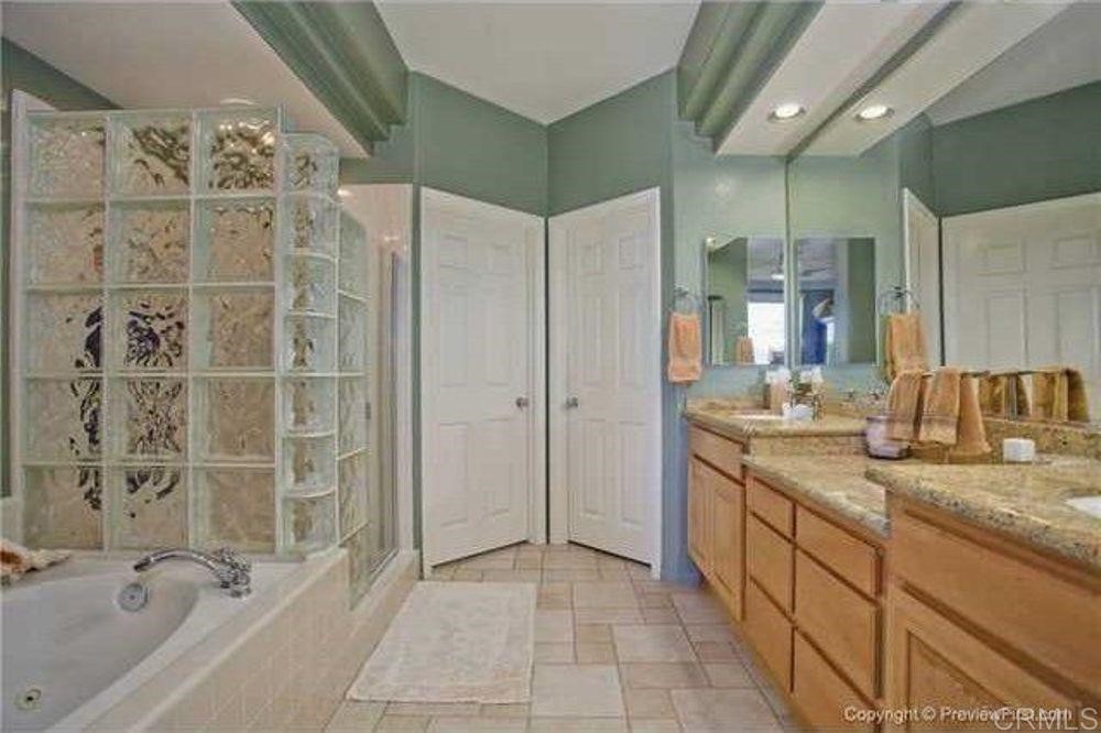 1624 Cormorant Drive Carlsbad, CA 92011 - Photo 11 of 13 a bathroom with a granite countertop sink a toilet and shower