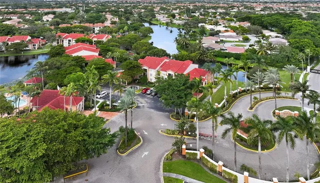 an aerial view of a house with a lake view