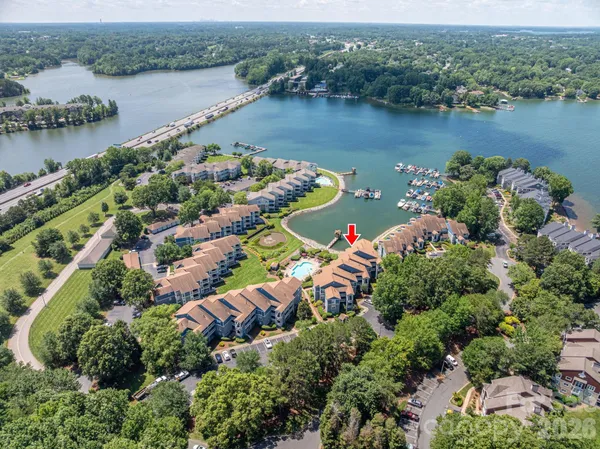 an aerial view of lake residential house with outdoor space and seating