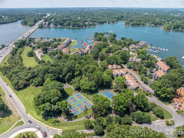 an aerial view of a houses with a lake view