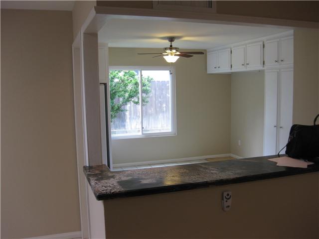 8527 Langholm Road El Cajon, CA 92021 - Photo 9 of 18 View of dining room from living room 'bar' area. Note teh extra cabinets and newer windows!
