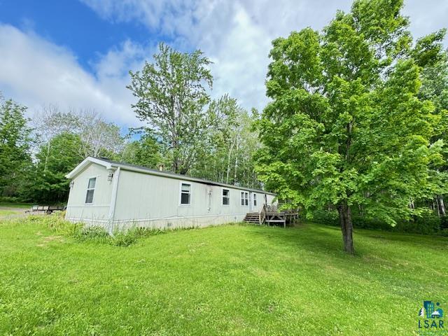 12 West St Louis River Road Esko, MN 55733 - Photo 20 of 20 Rear view of property featuring a lawn