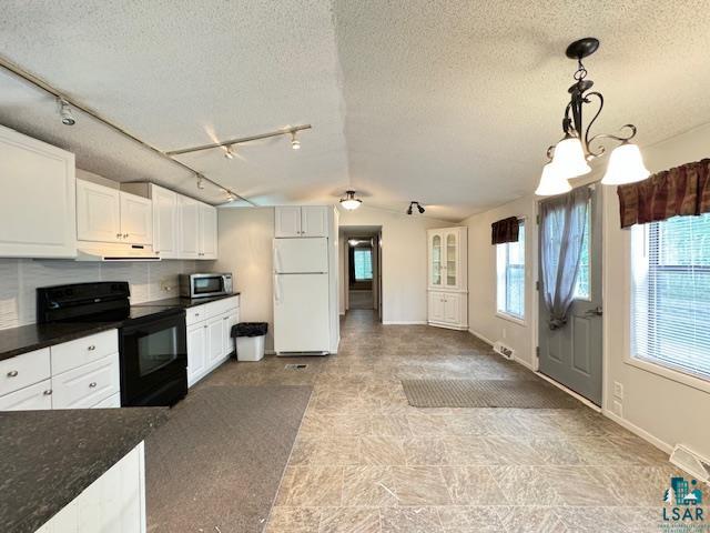 12 West St Louis River Road Esko, MN 55733 - Photo 8 of 20 Kitchen with electric stove, white refrigerator, pendant lighting, range hood, and white cabinets