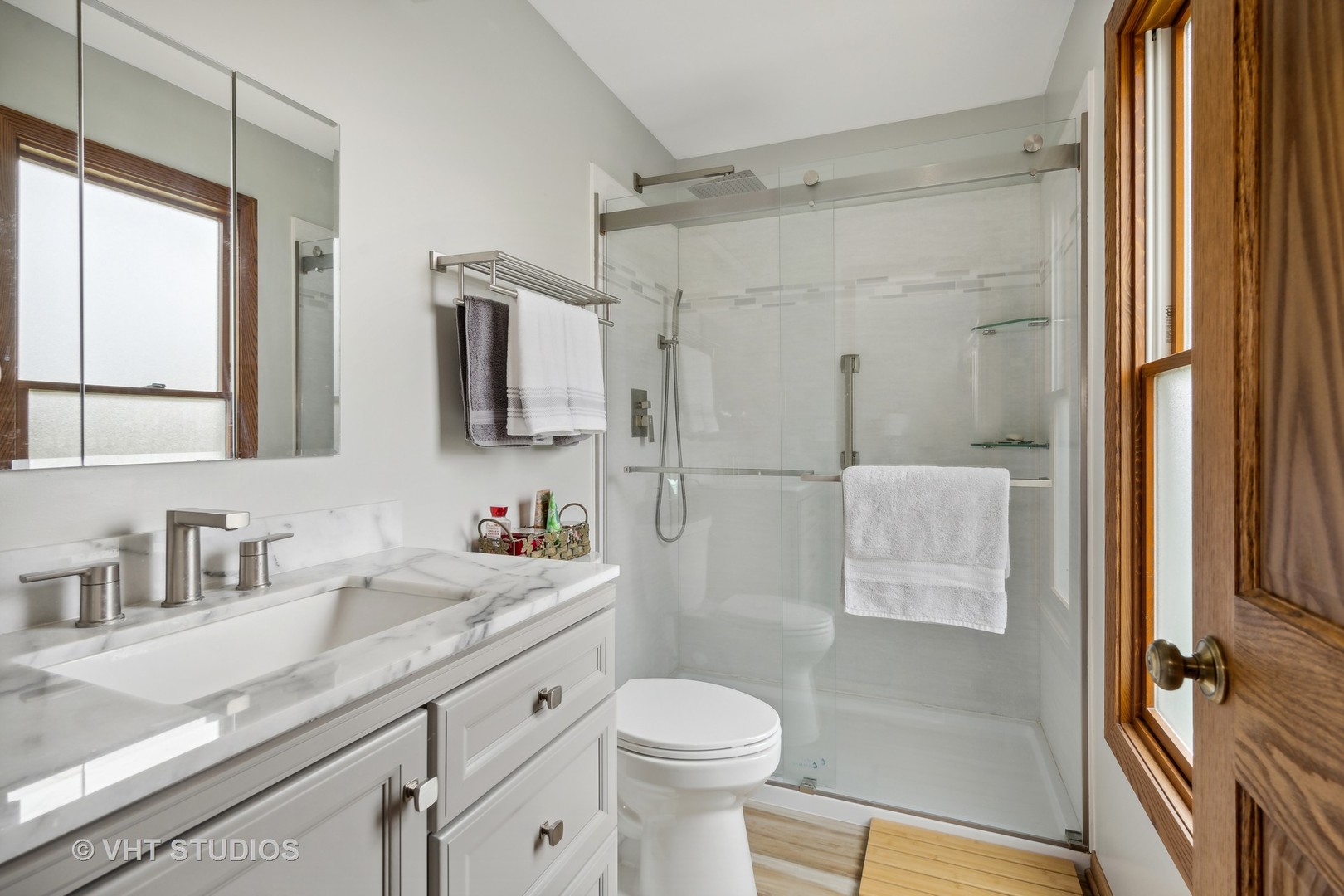 1402 Cherry Drive Batavia, IL 60510 - Photo 15 of 22 a bathroom with a sink toilet and shower