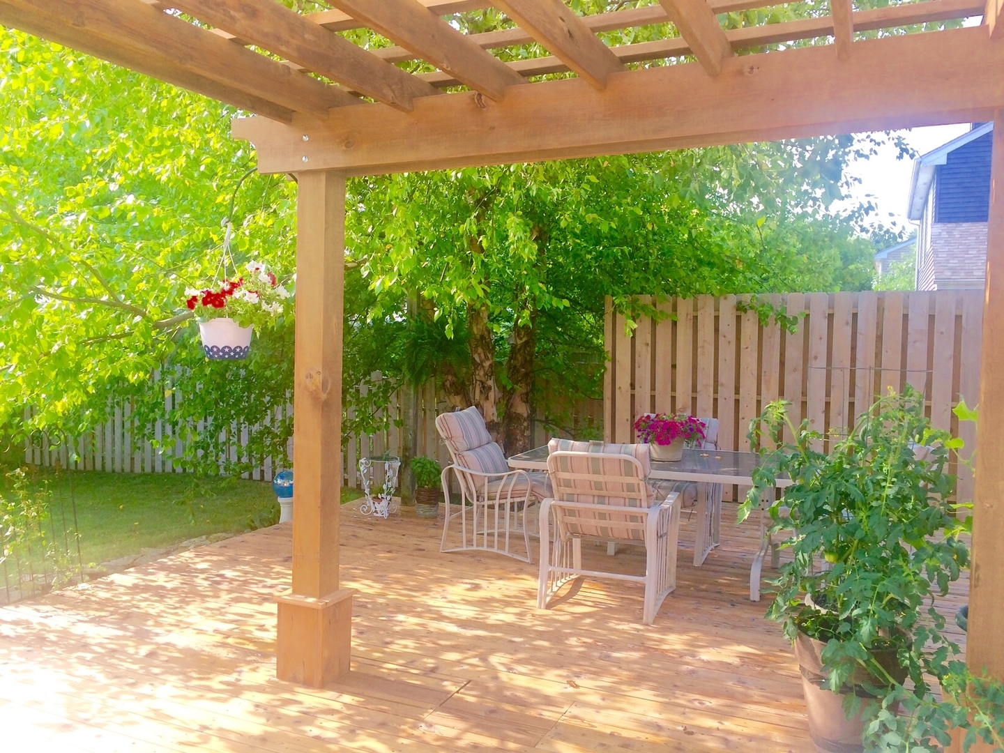 1402 Cherry Drive Batavia, IL 60510 - Photo 20 of 22 a backyard view with a garden and outdoor seating