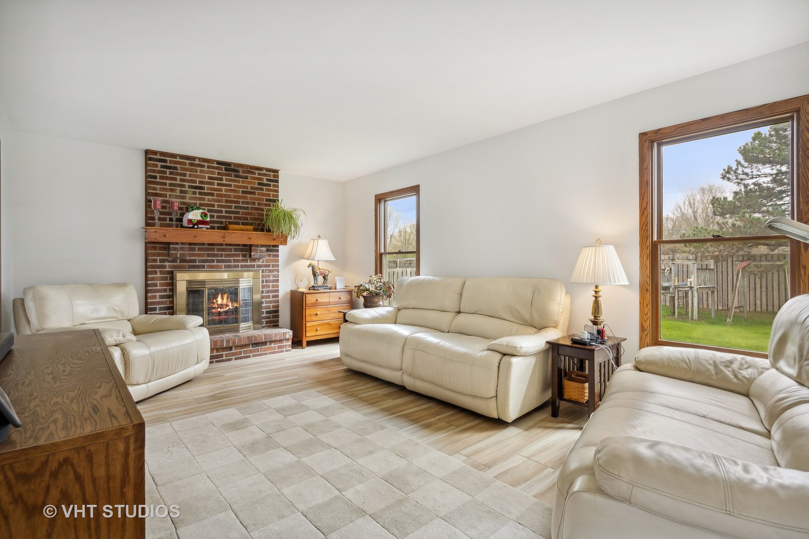 1402 Cherry Drive Batavia, IL 60510 - Photo 4 of 22 a living room with fireplace furniture and a large window