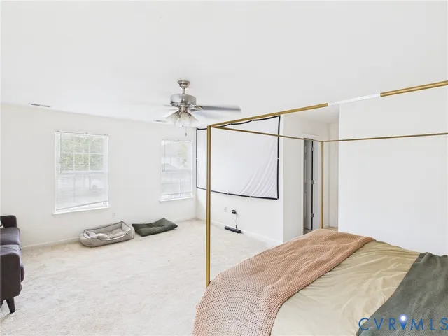 a bed room with a bed and a window