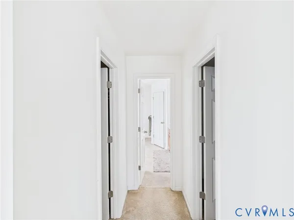 a view of a bathroom with a sink and a mirror
