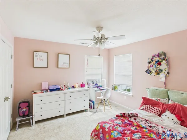 a bedroom with furniture and a bed