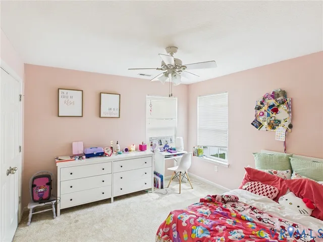 a bedroom with furniture and a bed