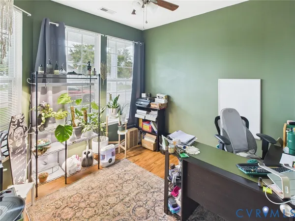 a room with musical instrument pool table and windows