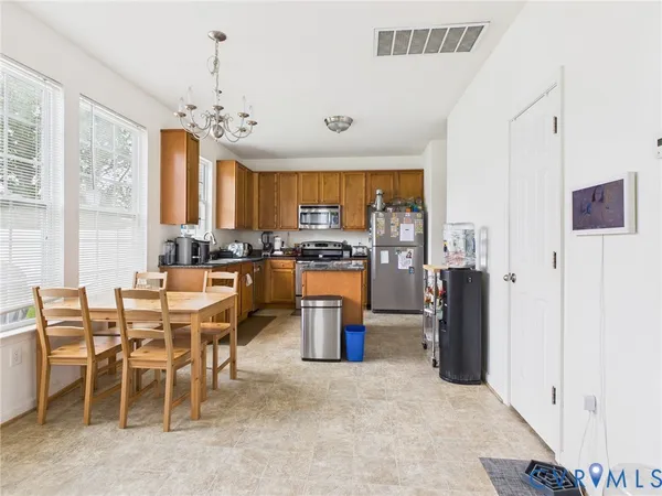 a view of a dining room with furniture window and outside view
