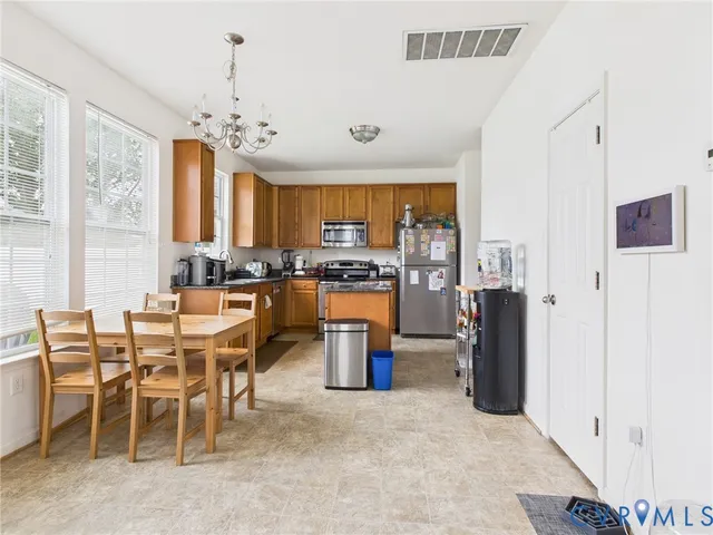a view of a dining room with furniture window and outside view