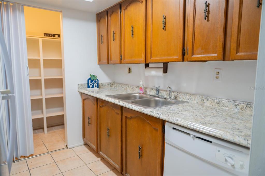 1902 Honour Road, Unit 23 Orlando, FL 32839 - Photo 13 of 31 a kitchen with stainless steel appliances granite countertop a sink and a window