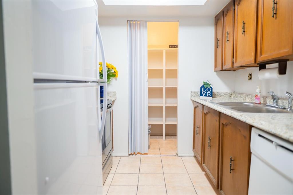 1902 Honour Road, Unit 23 Orlando, FL 32839 - Photo 16 of 31 a kitchen with granite countertop a sink and a granite counter tops